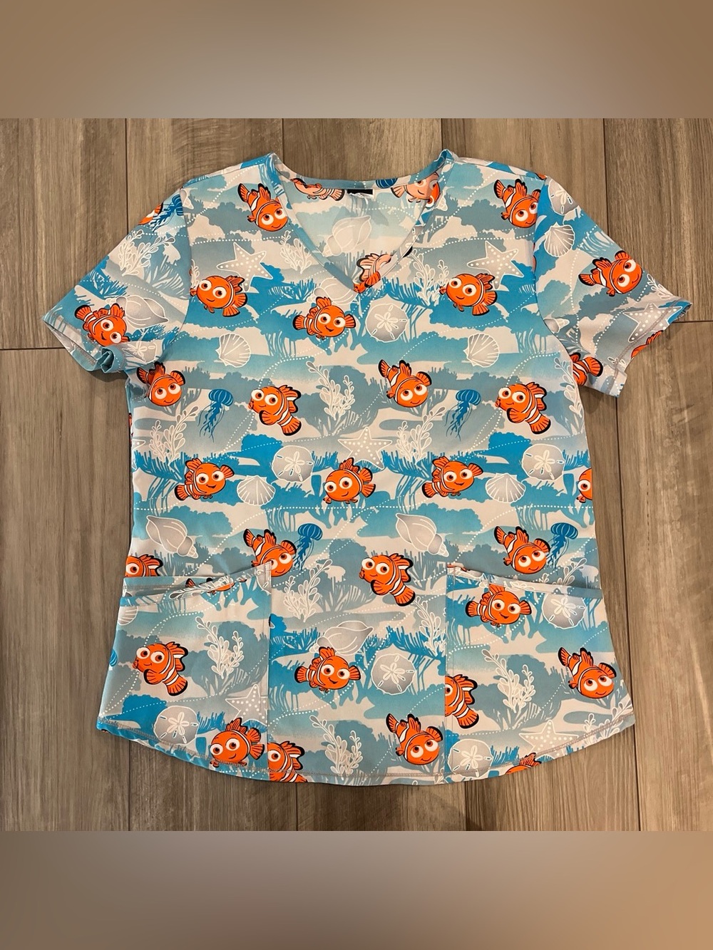Women’s Finding Nemo Short Sleeve Scrub Top - Blue & Orange